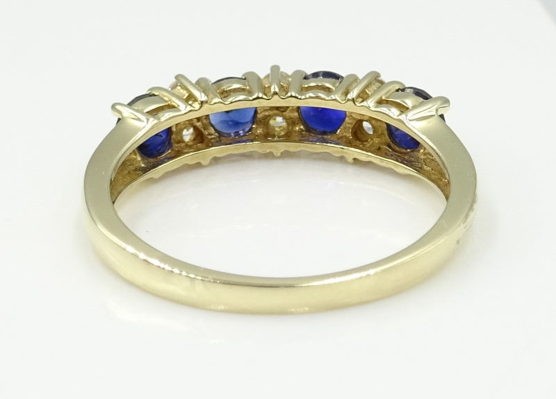 9ct gold CZ and synthetic Sapphire 1/2 eternity ring. 2.4gr