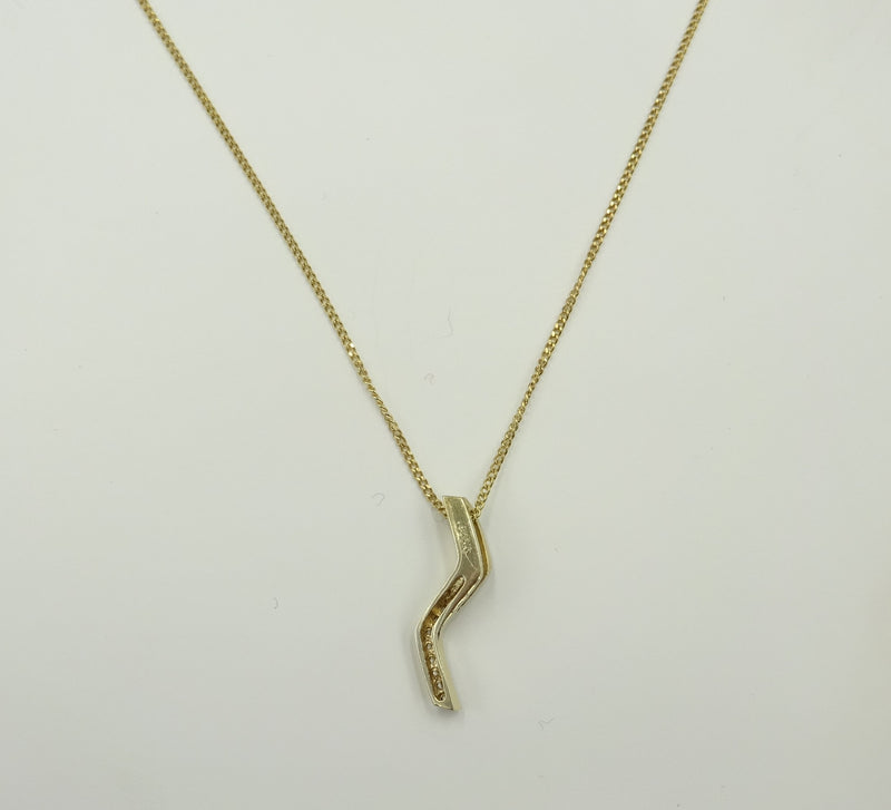 9ct gold CZ set Zig Zag style pendant on a chain. 2gr