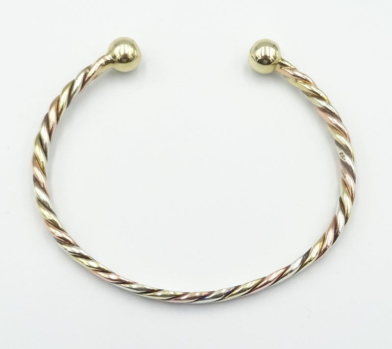 9ct 3 colour twist torque bangle. 15.2gr