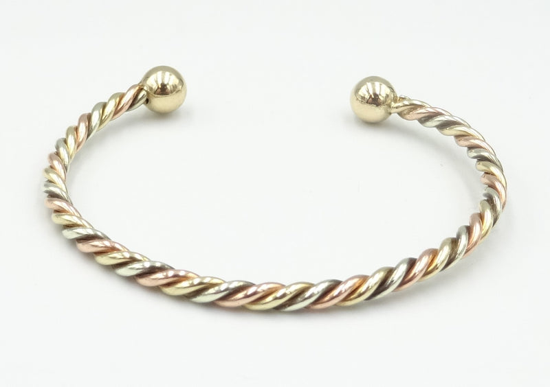 9ct gold 3 colour twisted child's torque bangle. 6.13gr
