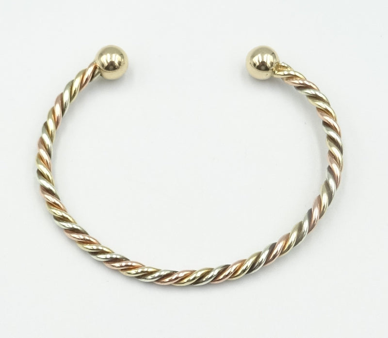 9ct gold 3 colour twisted child's torque bangle. 6.13gr
