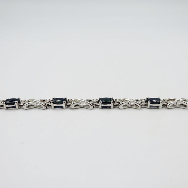 9ct White Gold 0.26ct Diamond & Oval Sapphire Ladies 'X' Bracelet 7.2g 7.5inch - Richard Miles Jewellers